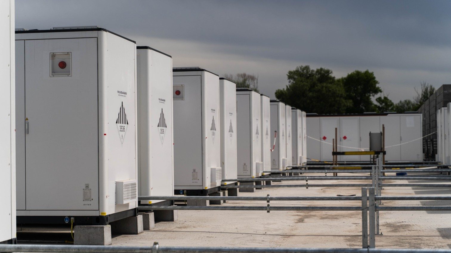 Rows of white battery storage containers at an ENGIE battery energy storage site