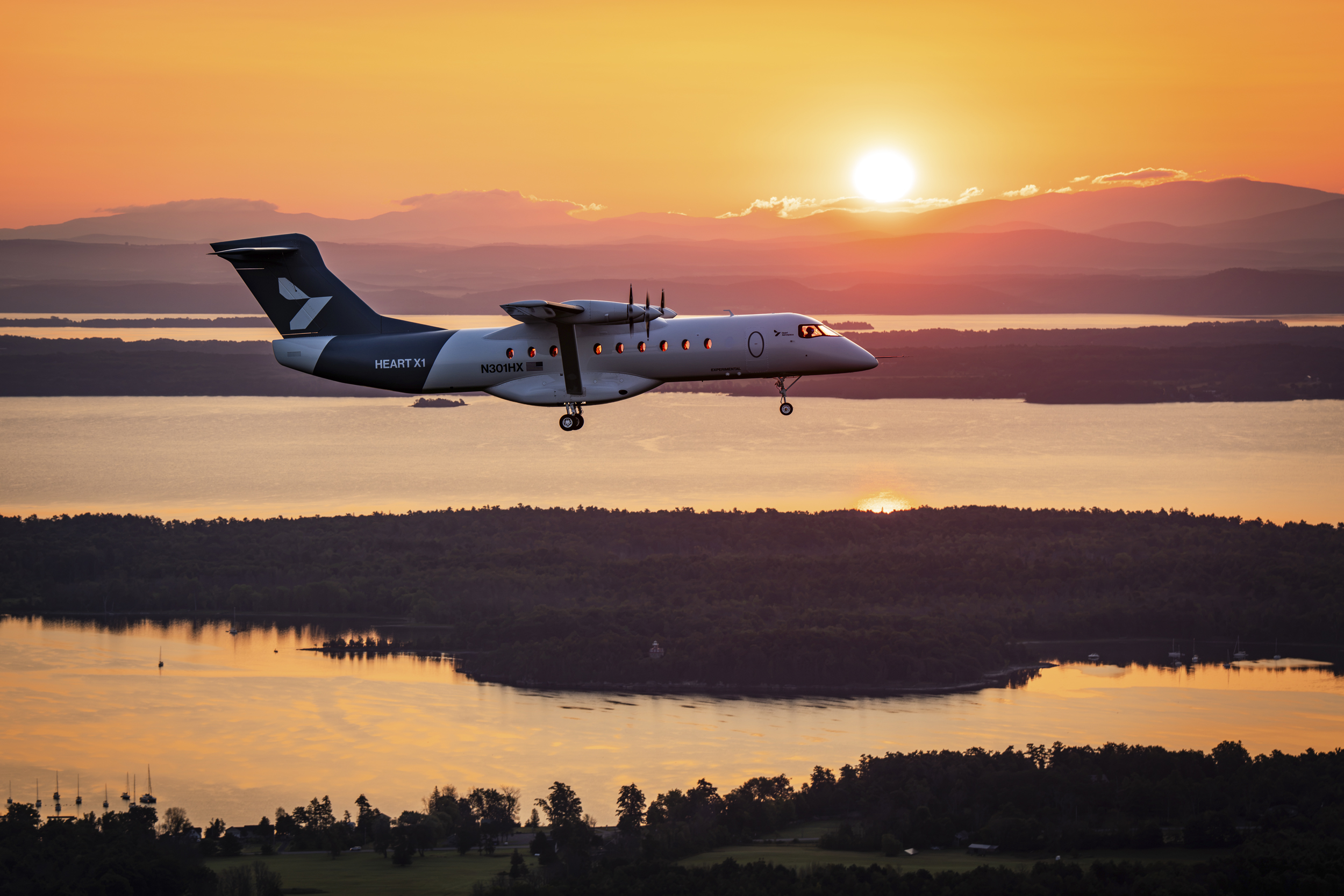 Heart Aerospace's X1 demonstrator aircraft in flight at sunrise during its first flight near Plattsburgh, New York.
