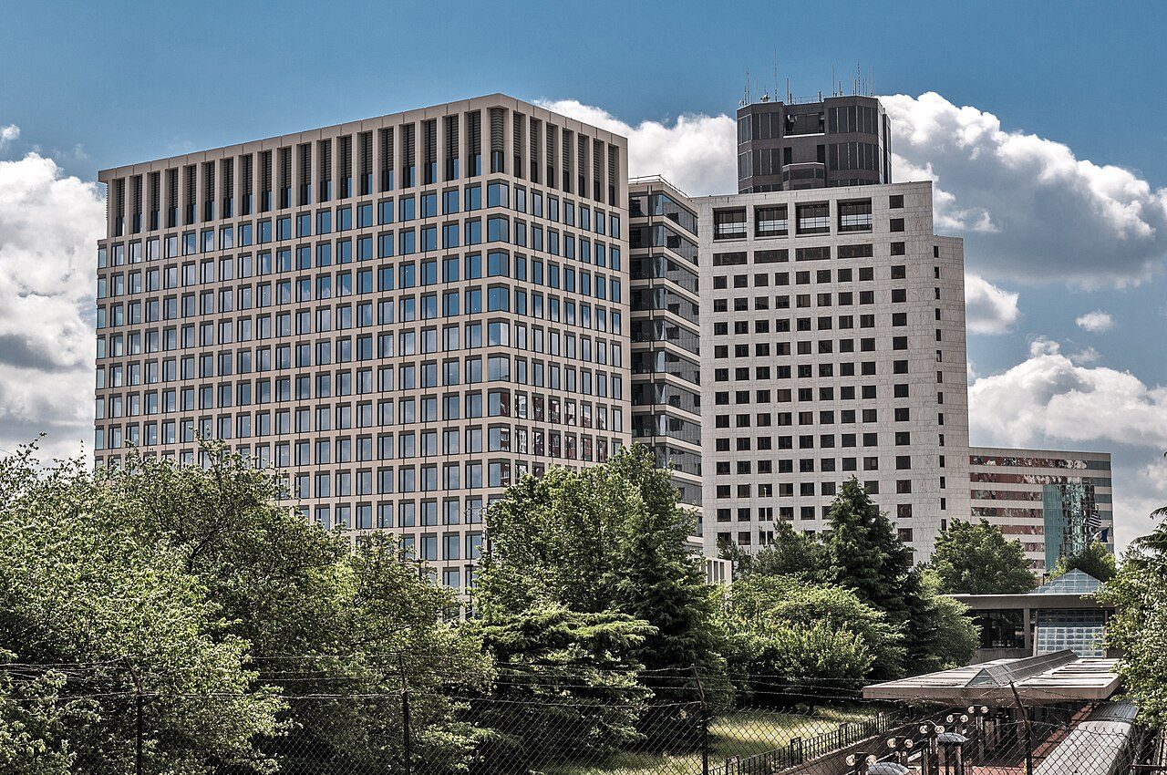 The Nuclear Regulatory Commission headquarters buildings in Rockville, Maryland, with a Metro train passing in the foreground