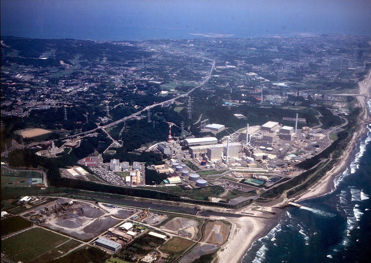 Aerial view of the Hamaoka Nuclear Power Station on the Pacific coast of Shizuoka Prefecture, Japan, with its reactor buildings and stacks beside the shoreline