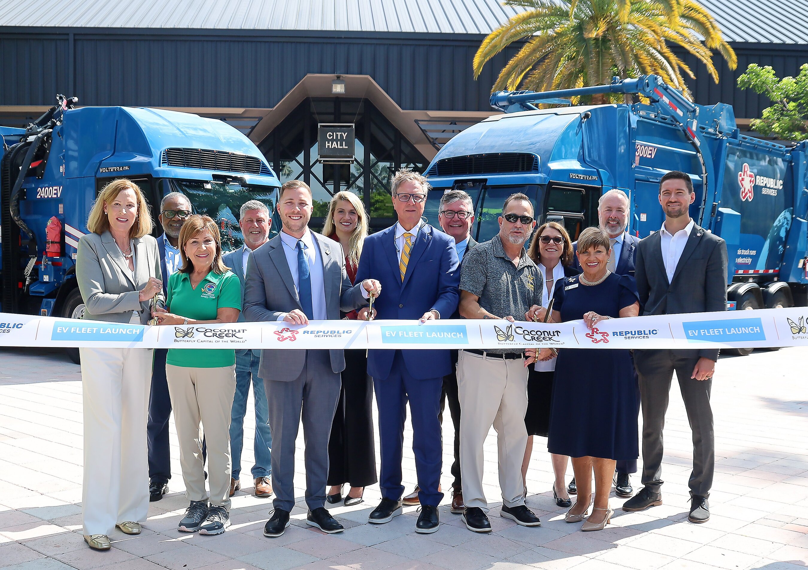 Coconut Creek officials and Republic Services employees celebrate at the launch of the city's fully electric residential collection fleet