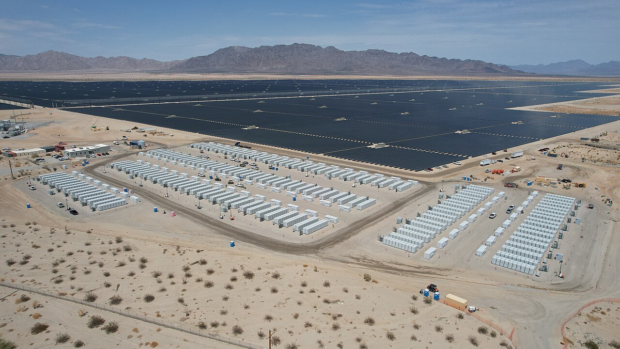 Aerial view of battery storage container rows beside the Desert Sunlight solar field on public lands near Desert Center, California